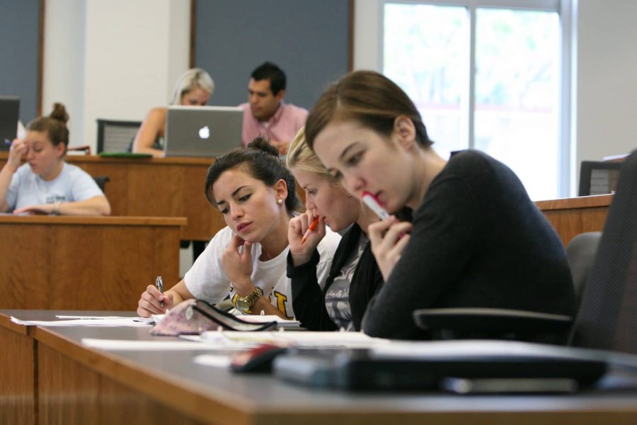 Students in class concentrating on their work