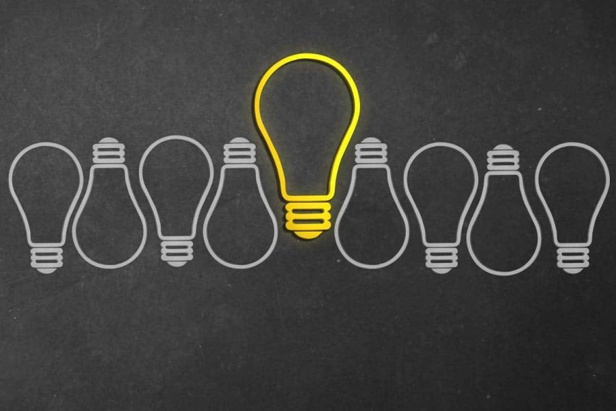 Graphic depicting grey lightbulbs with the center one larger and in yellow