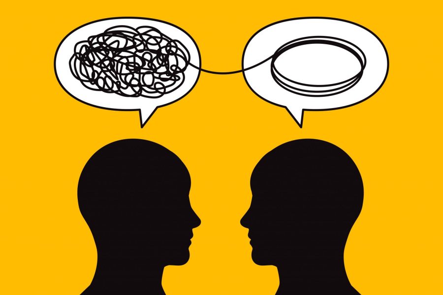 Two head profile sillouhettes facing toward each other solving a problem