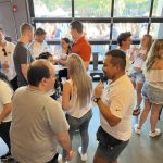 UF MBA students networking at an event.
