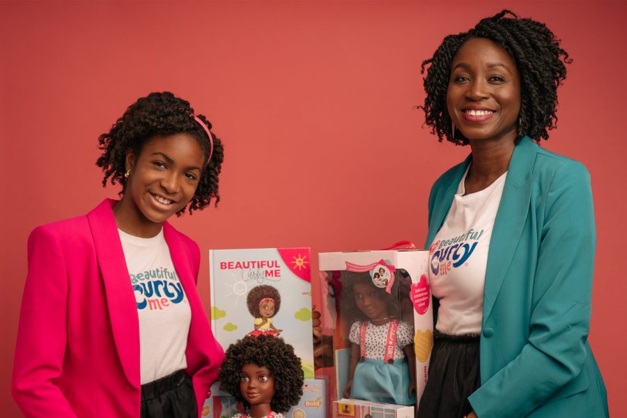 Evana and Zoe Oli pose with products from their business.