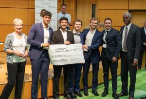 MSRE team holds a giant check for $5,000
