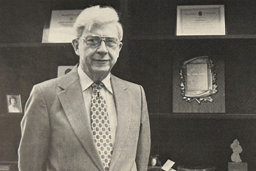 Dr. C. A. Matthews poses with awards.