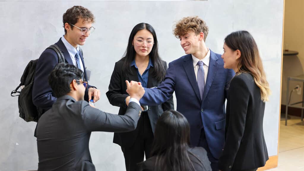 University of Florida business students collaborate and celebrate as a team during the Florida Investment Conference at Warrington College of Business.