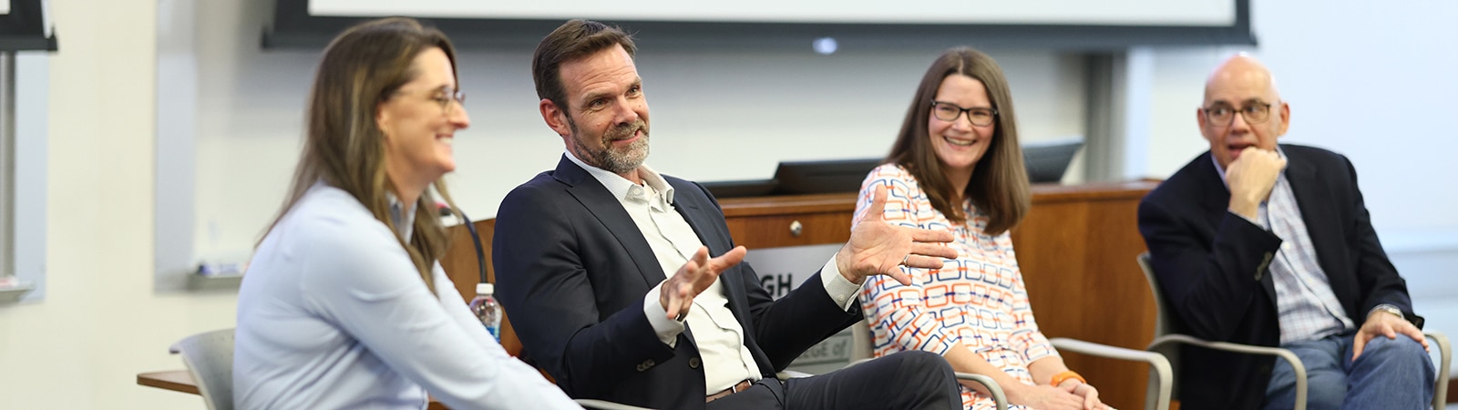 Four panelists, engaged in discussion at the FPD Market Talk event on the University of Florida campus.
