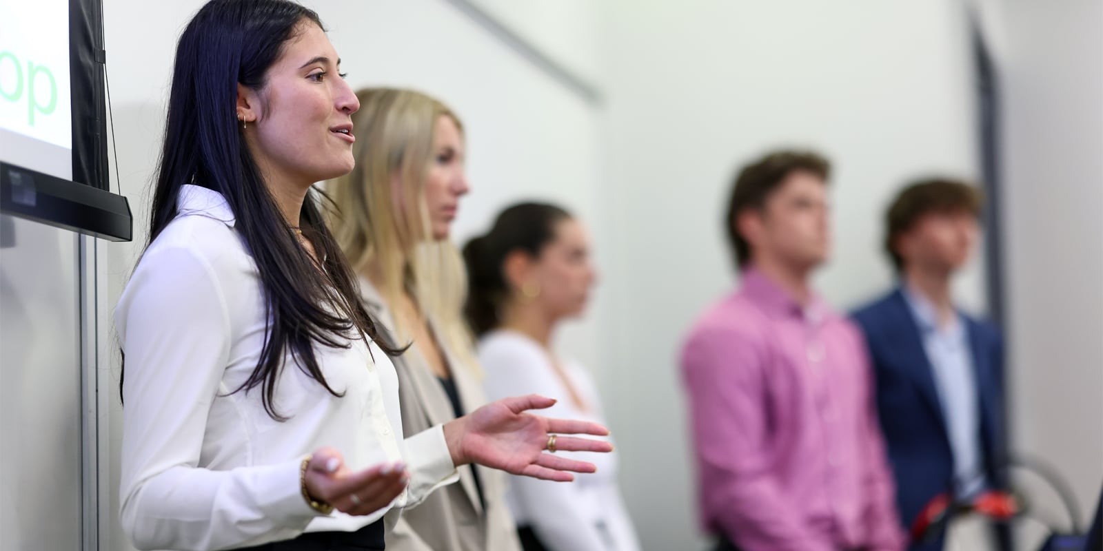 Female student presenting in a sales competition.