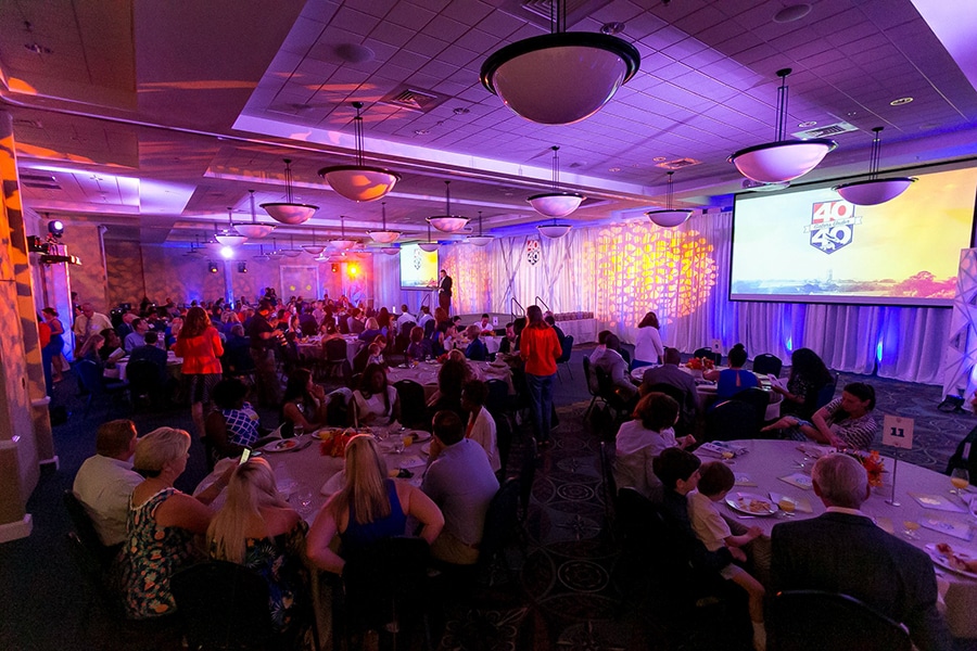 University of Florida alumni sit around tables for a 40 Gators Under 40 event