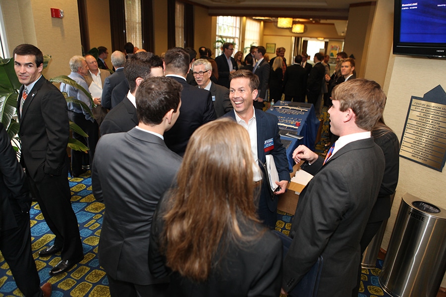 UF Warrington College of Business students interact with alumni and industry professionals during a networking event hosted by the Bergstrom Real Estate Center