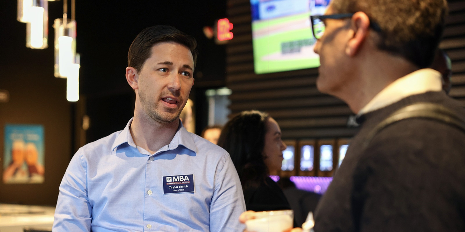 Two students from University of Florida's Executive MBA have a discussion during the Summit Series