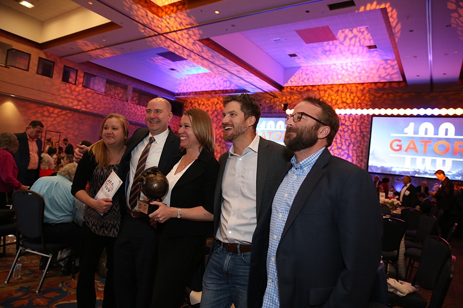 Students from the Warring College of Business pose for a photo during a University of Florida Gator 100 event intended for entrepreneurs.