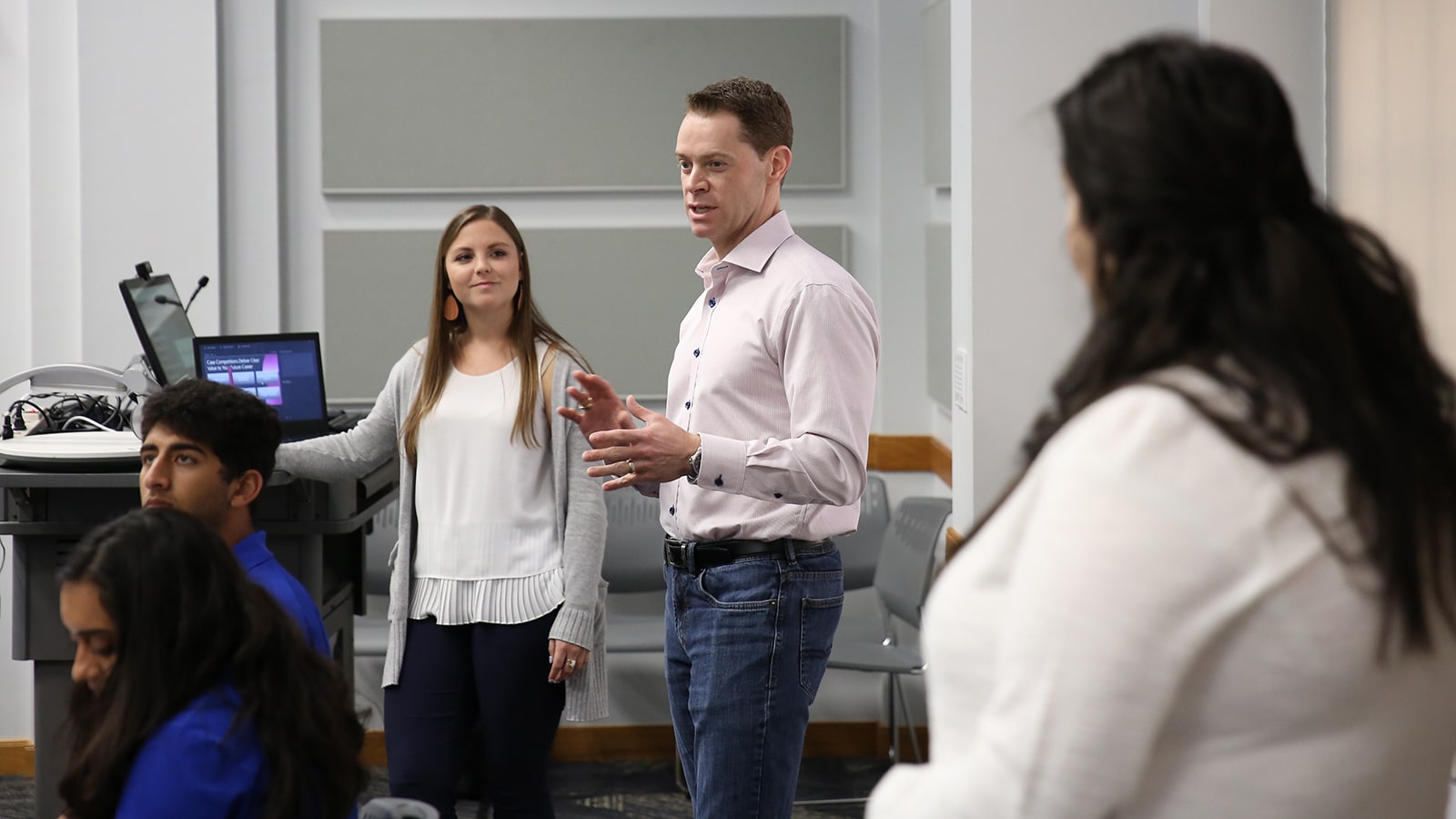 A professor at the University of Florida Warrington College of Business presents a new concept while students actively listen