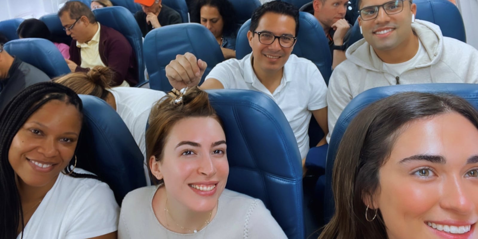 Students from UF Warrington's South Florida Weekend Part-Time MBA program on a plane as they fly to the destination of their Global Immersion Experience