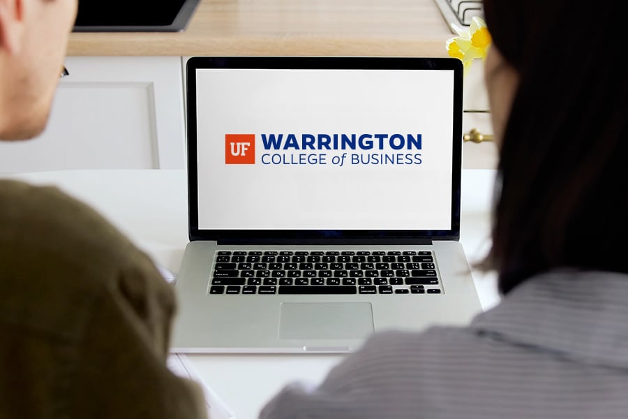 Warrington College of Business logo on a laptop screen.
