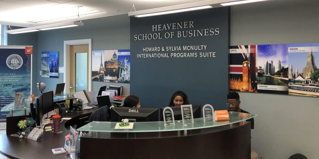 BABA students review resources about studying abroad in a common area in the UF Warrington College of Business' Heavener Hall
