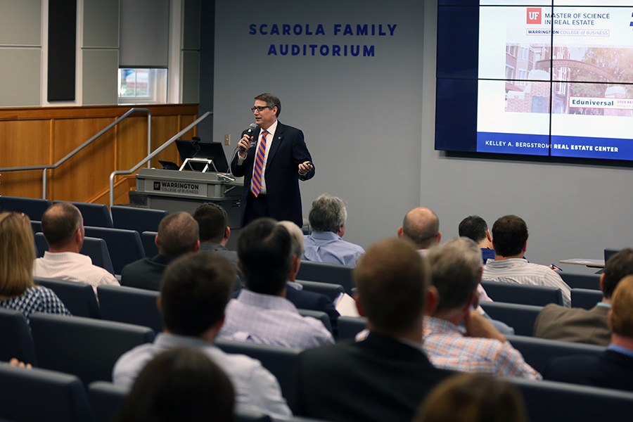 Tim Becker speaking to a crowd. 