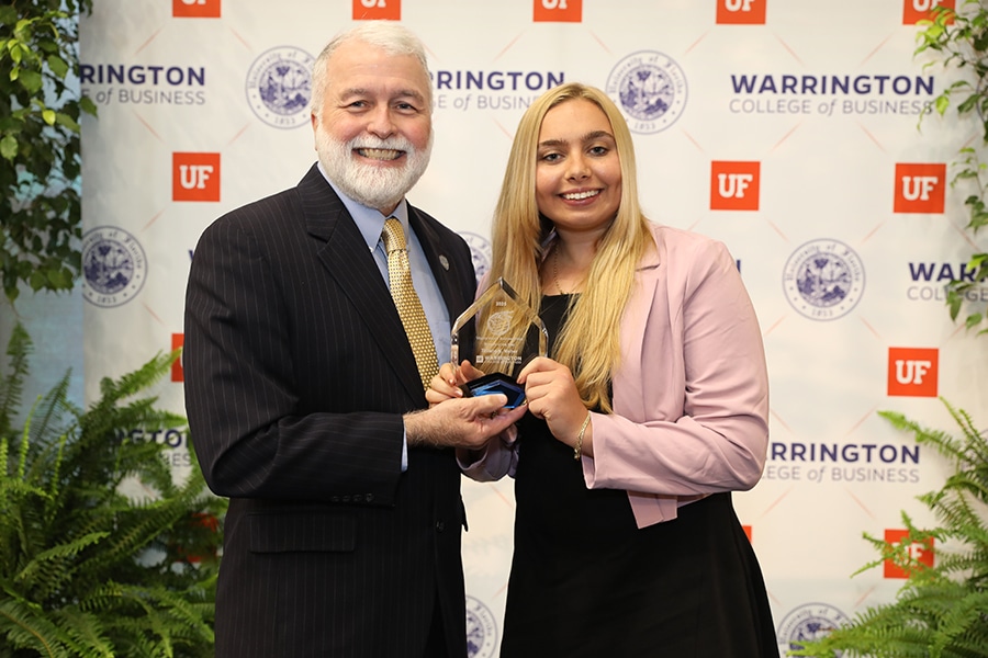 Tatiana Maher winning the Virginia Maurer Business Ethics Student of the Year Award.