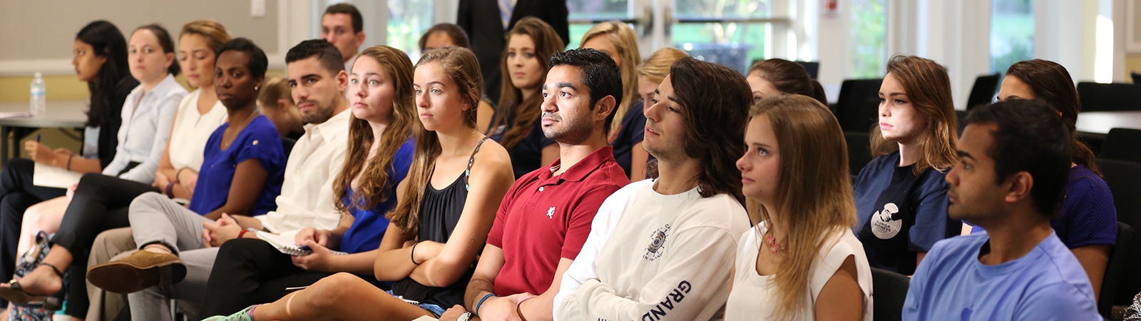 Students listening to a Business Ethics speaker. 