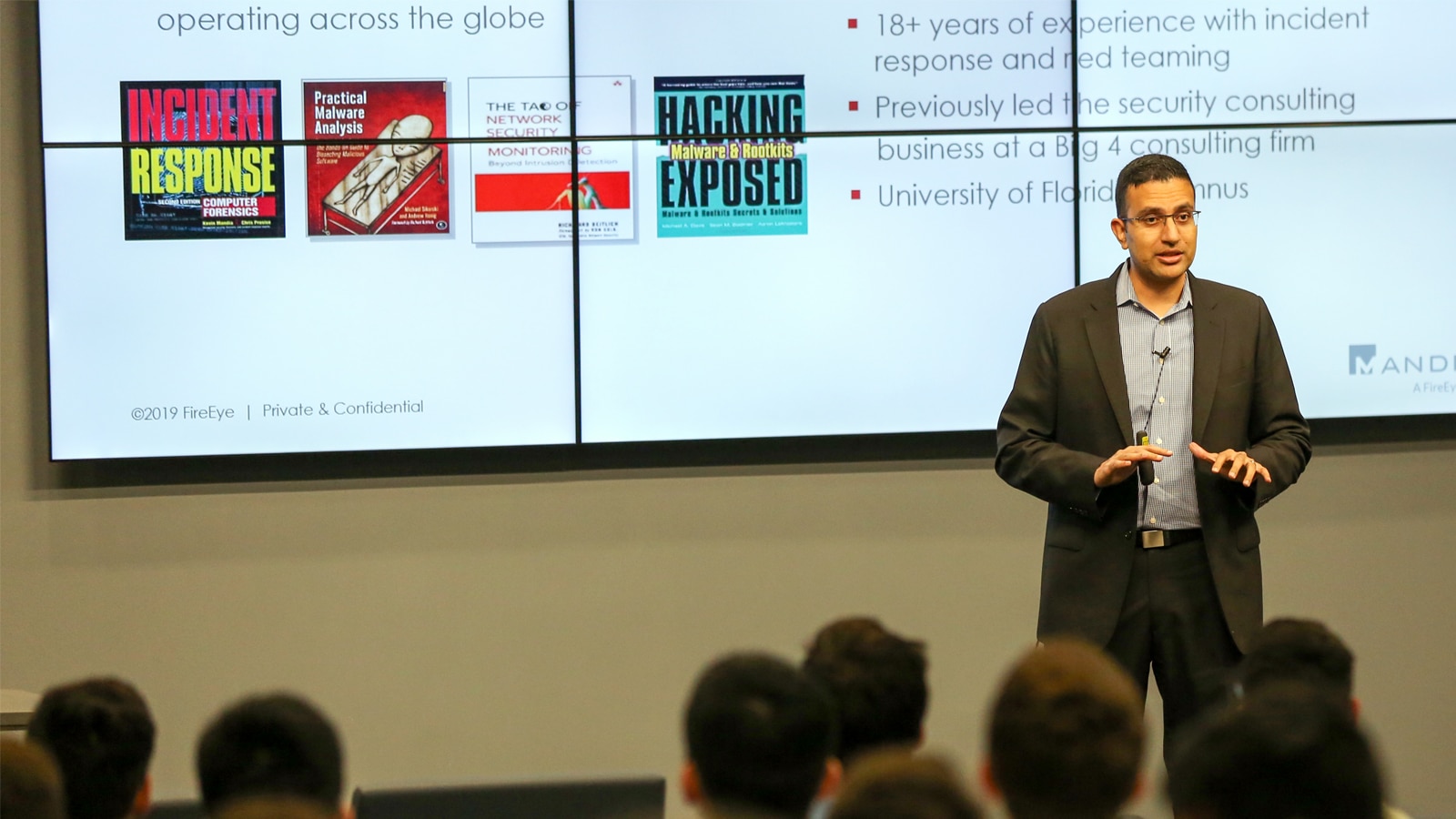 Charles Carmakal, guest speaker at the Supply Chain Management Center event, addresses a room of information systems and operations management students and faculty.