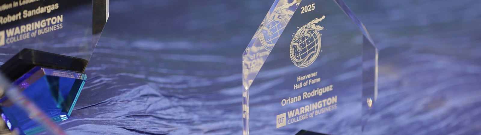 Closeup of awards on a table for Warrington College of Business students.
