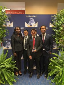 Kevin Bencomo receiving Heavener Gator Globes Award alongside Shane Allicock, Yemima Dort and Johender Suarez.