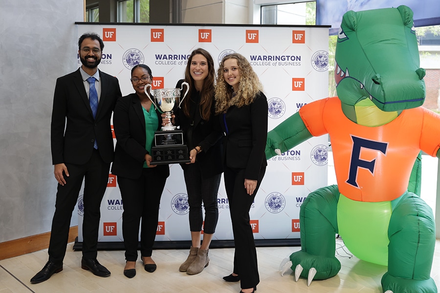 MBA Case Competition winners holding an award. 