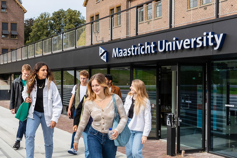 Students existing a Maastricht University building. 