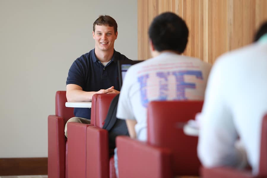 Male student smiling at the camera. 