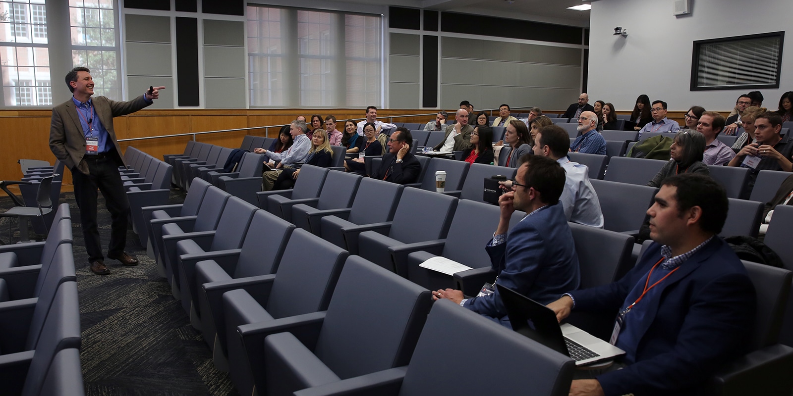 A speaking in front of an audience. 