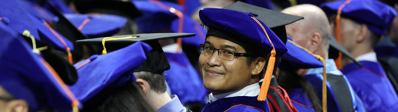 Students from the University of Florida Warrington College of Business' PhD in Marketing program in caps and gowns during commencement