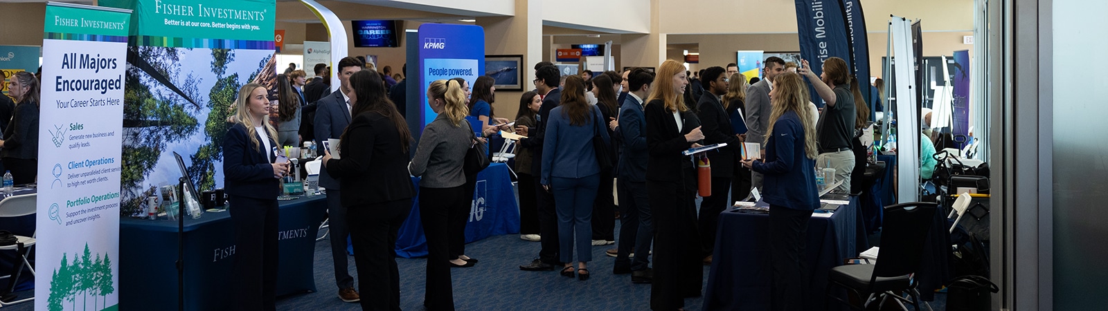 Students and employers networking at a recruiting event.