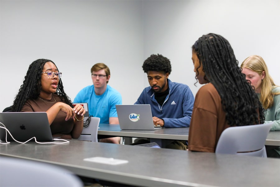Students working together in a classroom. 