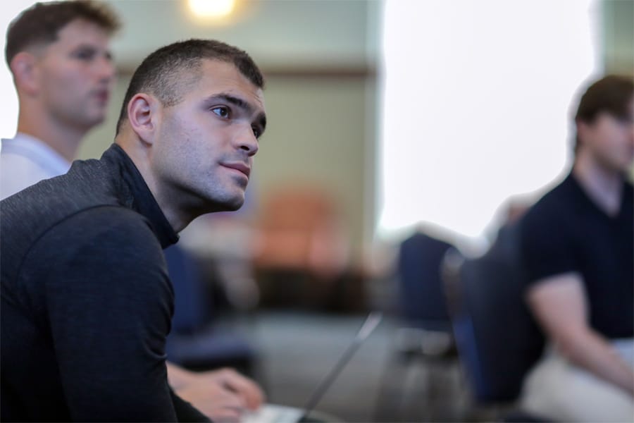 Attentive student listens during an on-campus MBA lecture