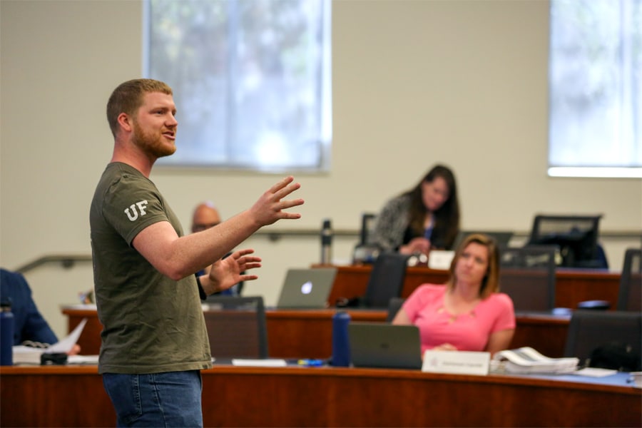 Student presents in class during UF’s full-time MBA program
