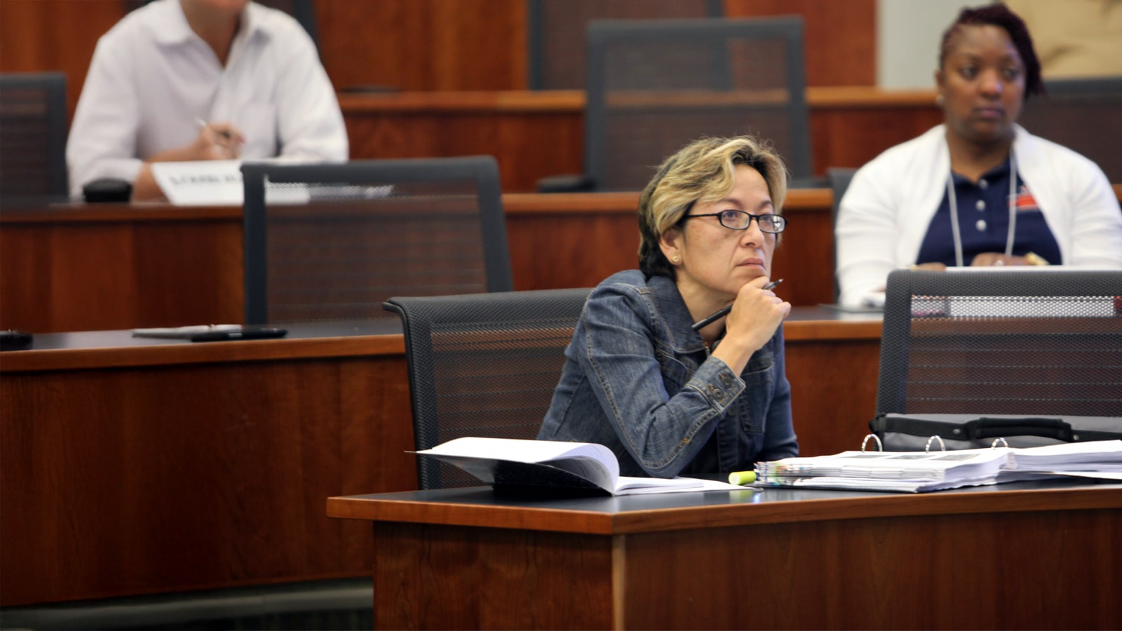 Focused student listens during weekend MBA class session