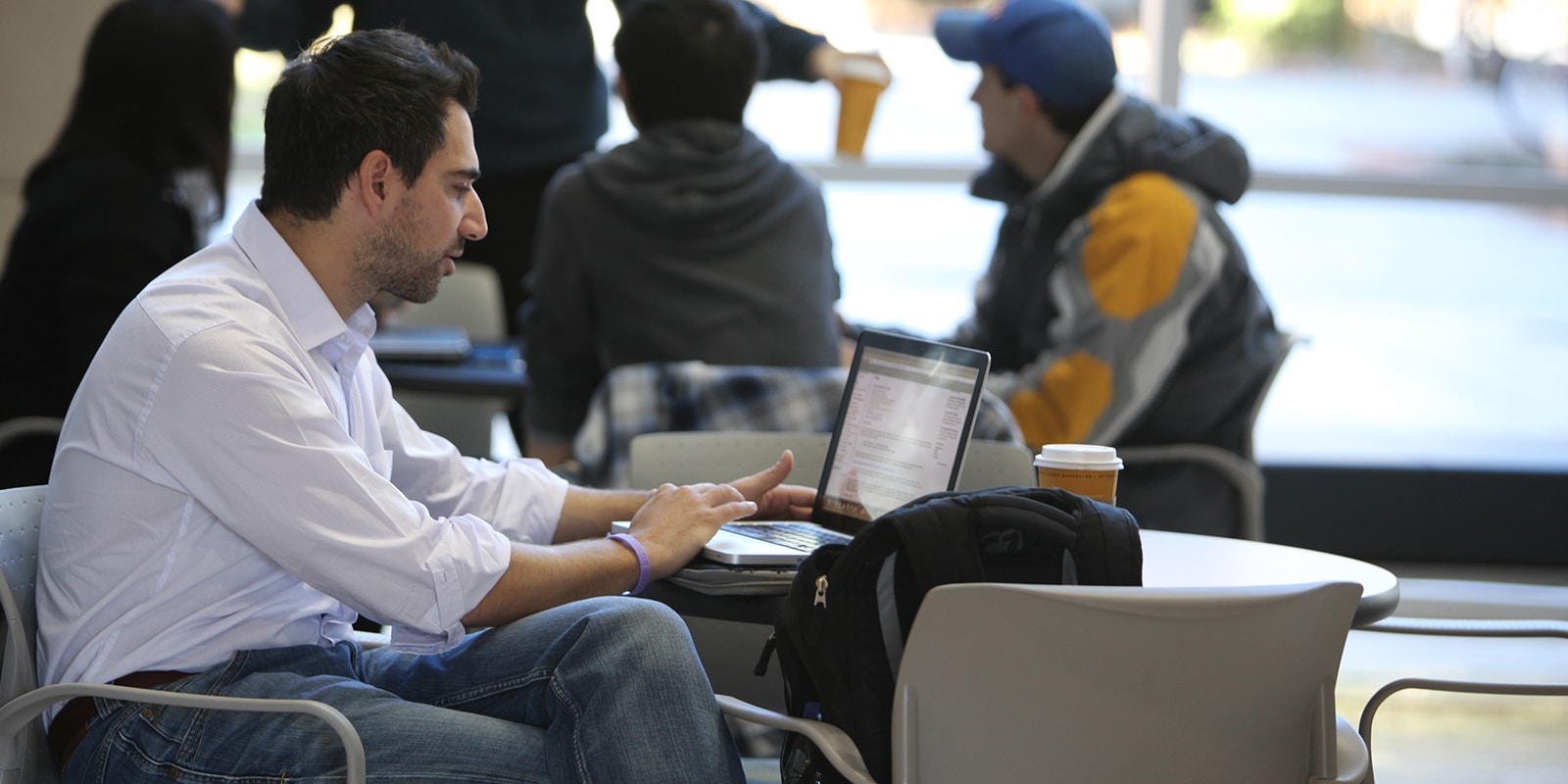 Graduate student working on a computer in Hough Hall
