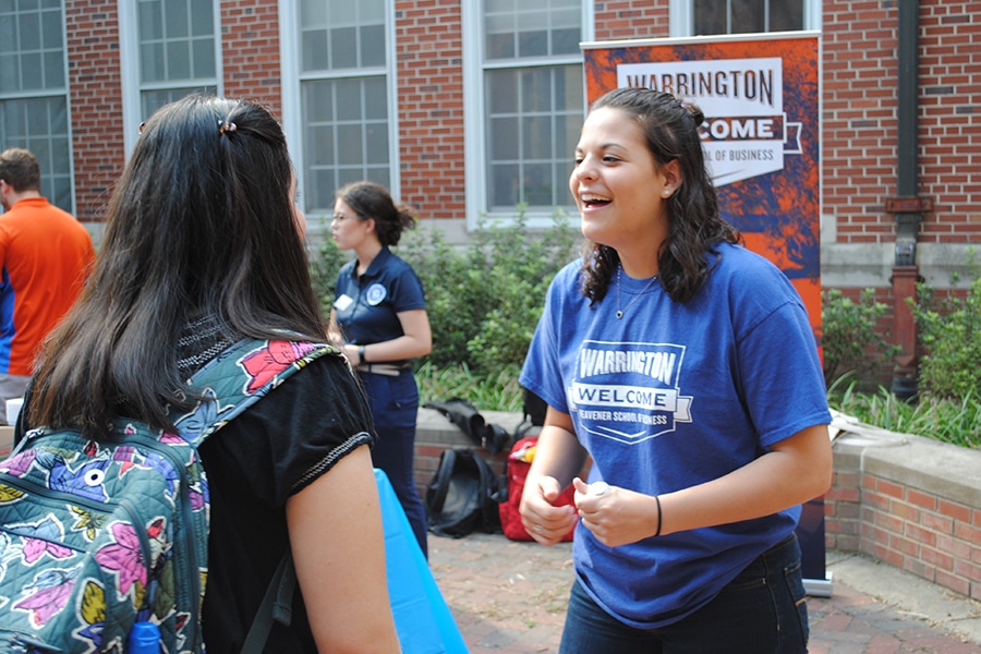 Students interacting at a Warrington Welcome event.