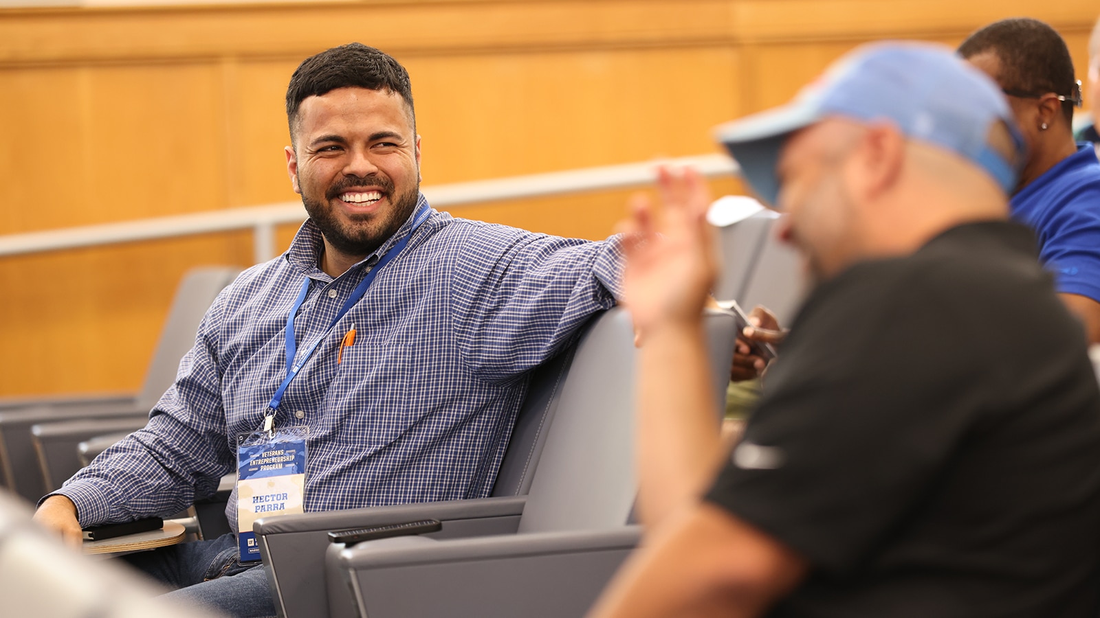 Smiling man at an on-campus military event. 