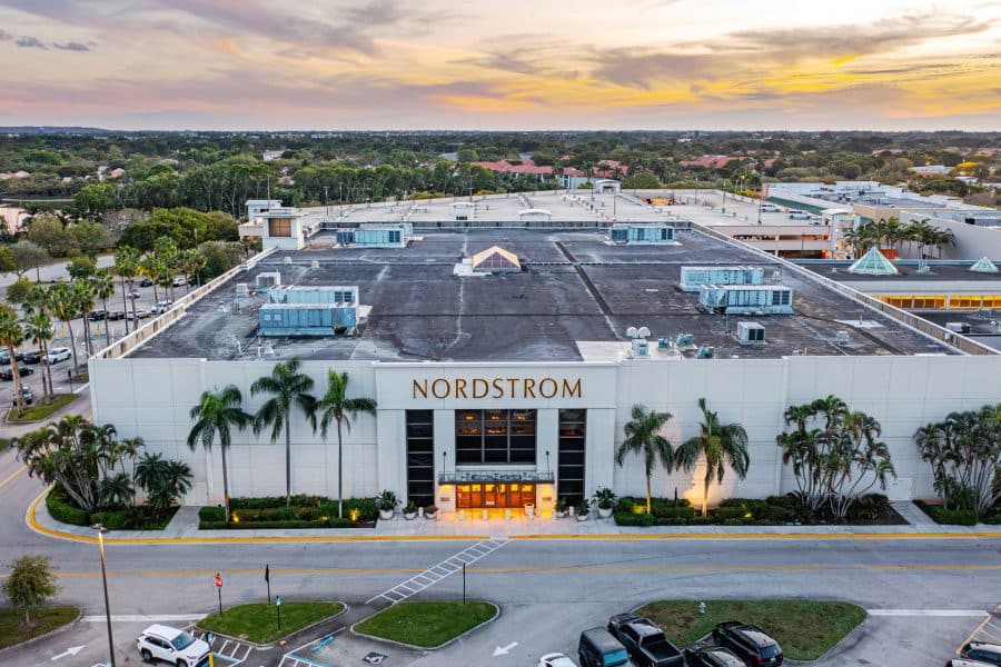 Nordstrom store front from above lined with palm trees in the a town center in Boca Raton, Florida.