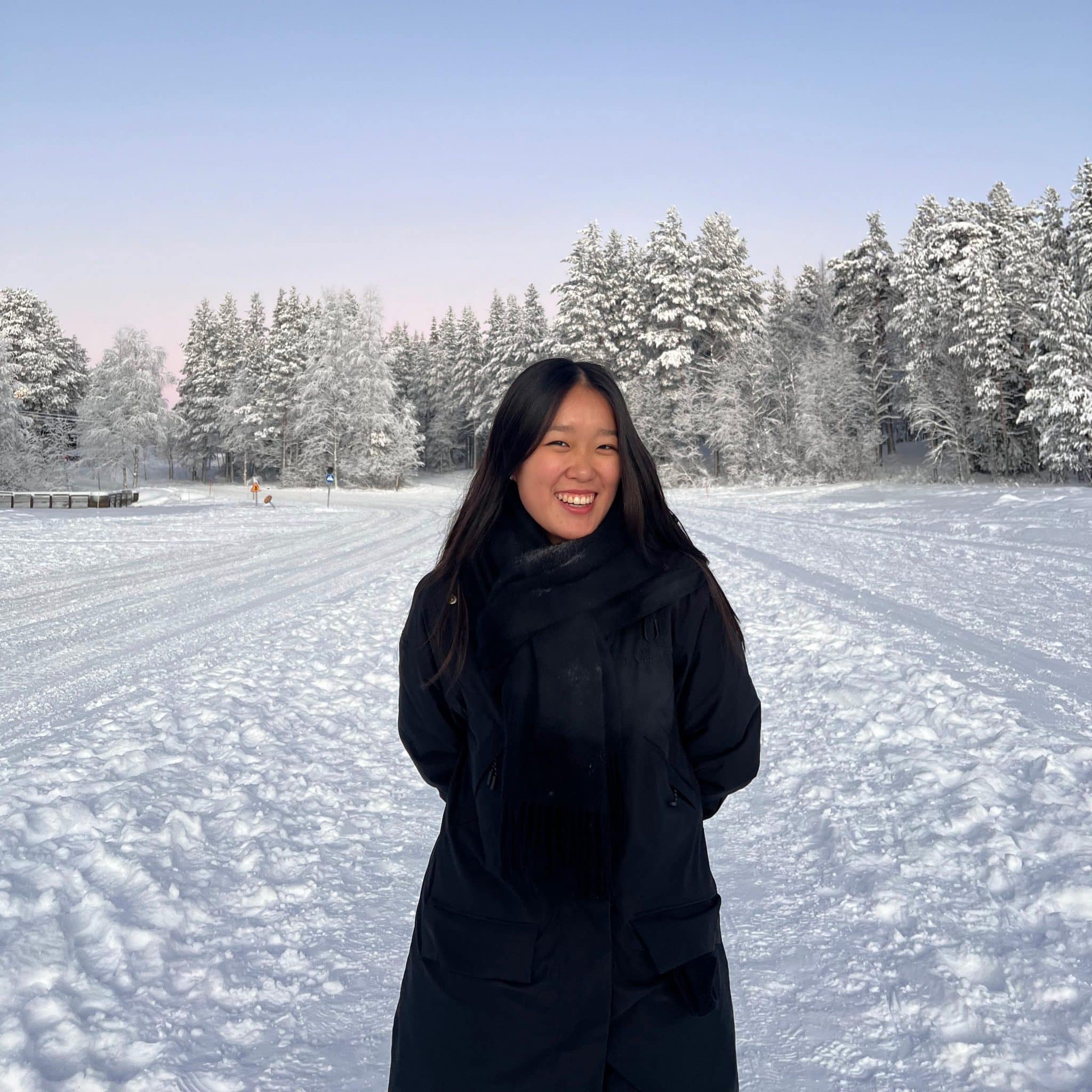 caroline yu standing in the snow in helsinki, finland