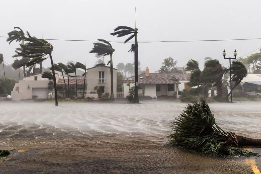Coastal homes during a hurricane endure winds and storm surge