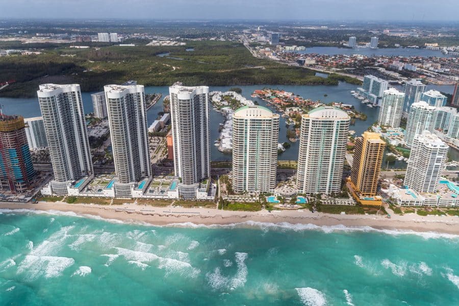 An aerial view of condos lining the coastline
