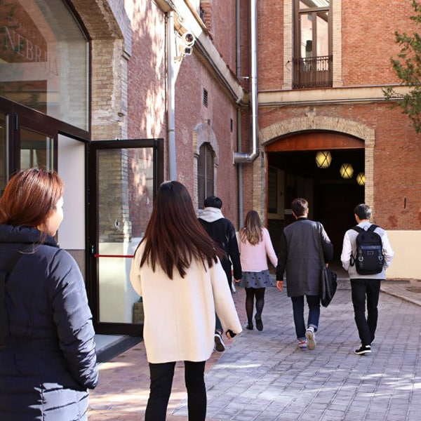 Students walking by buildings on the Nebrija campus