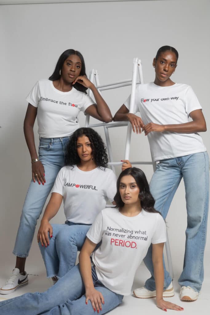 Aanya Patel poses with models wearing branded clothing for the Global Girls Initiative.