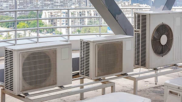 Heating and cooling units on top of a building in New York City.