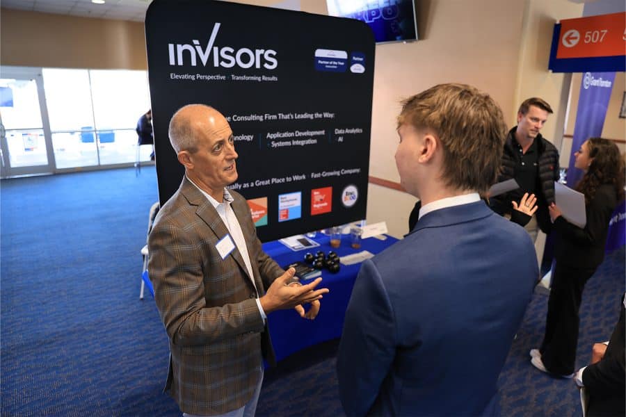 Invisors employees recruiting UF Warrington students.