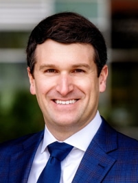 Sam Warfield headshot; smiling