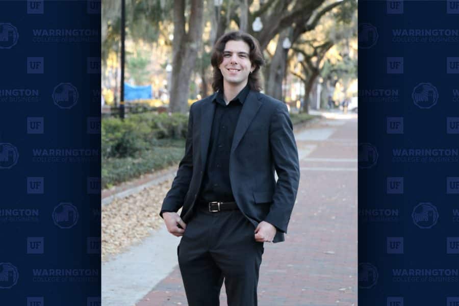 garrett goodkin standing in plaza of the americas smiling