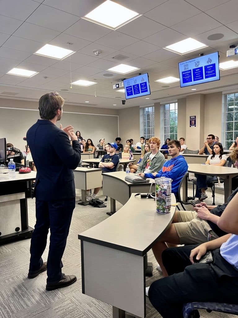 Matthew Smith speaks in front of members at a Business Law Society Meeting. 