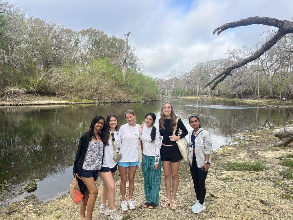 Students from Eco-Gator, UF Surfrider, Florida Freediving Club, and members of the local Fort White community pose after cleaning up the Ichetucknee River.