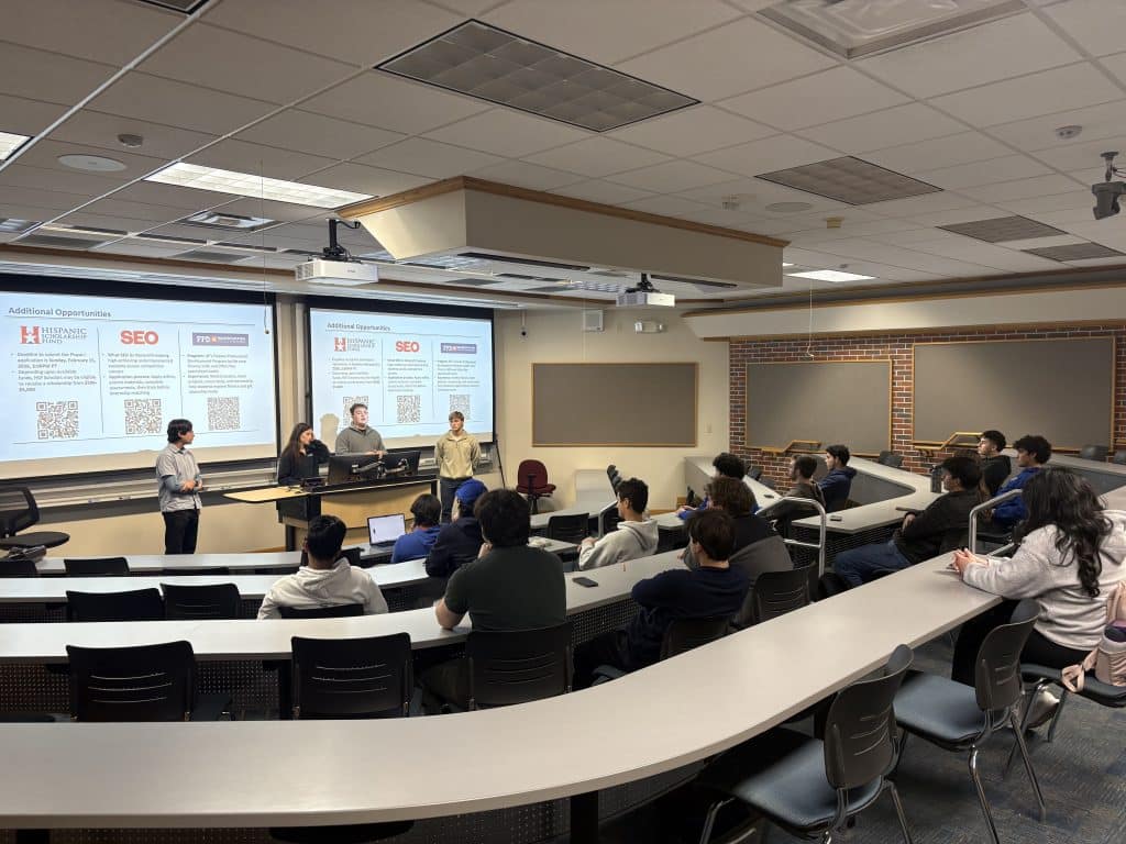 Alejandra Sammataro leads a workshop with fellow members at a Hispanic Finance Association meeting.